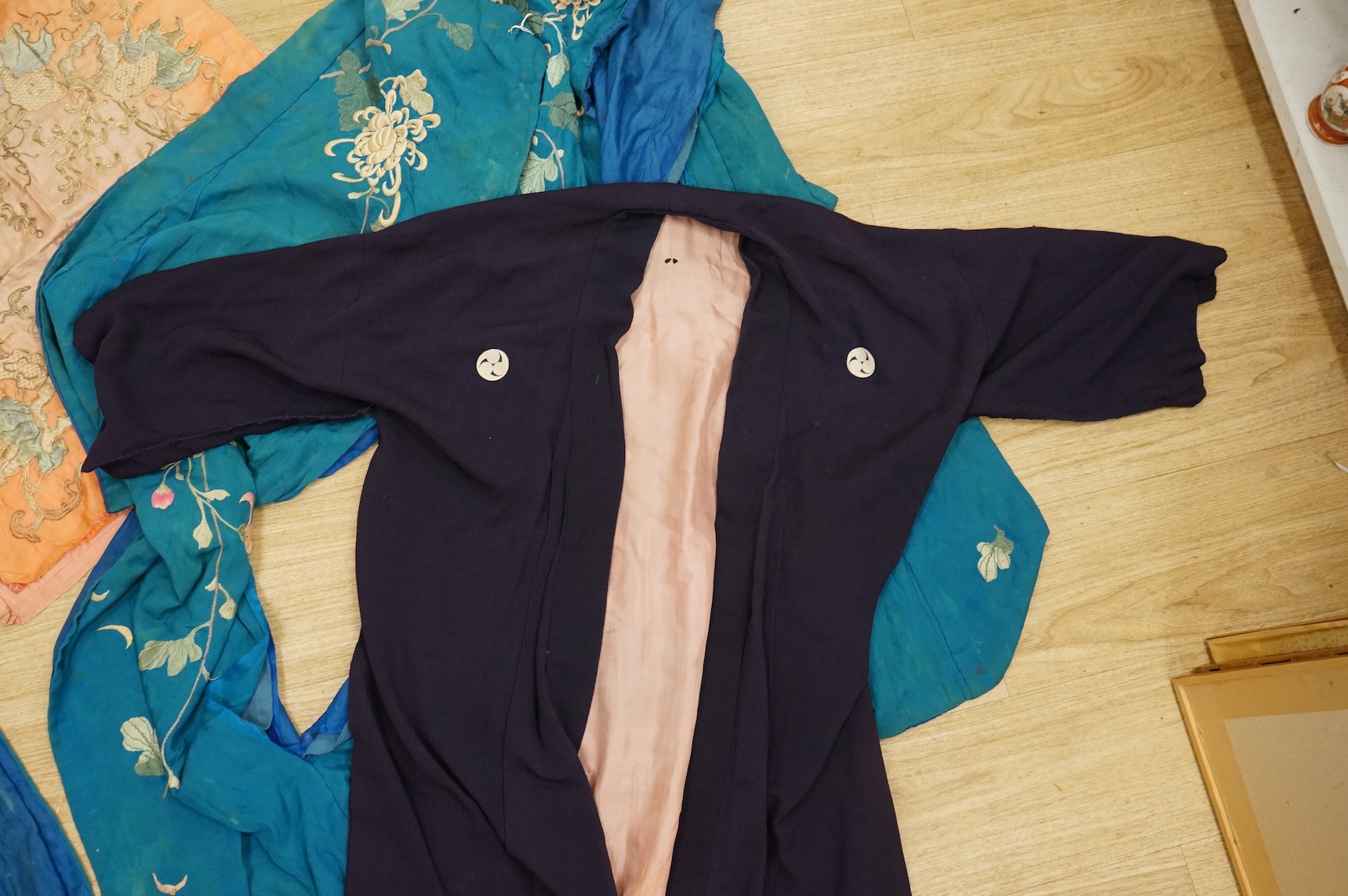 A collection of Chinese and Japanese embroidered kimonos and textiles